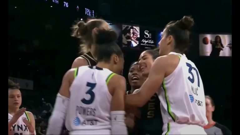 Kelsey Plum and Aerial Powers bark at each other after a play